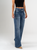 Ref: 065771 Jean Mom Flare, stretch, tiro alto, tono azul oscuro, detalle en pretina