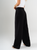Ref: 069750 Pantalón mom flare, prenses, tejido plano liviano, tiro alto, tono negro