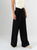 Ref: 069823 Pantalón palazzo, detalle delantero, tejido plano liviano, tiro alto, tono negro