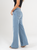 Ref: 064977 Jean Mom Flare, rígido, tiro alto, tono azul medio, detalle en pretina