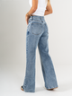 Ref: 065724 Jean Mom Flare, rígido, tiro alto, tono azul medio, detalle en pretina