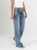 Ref: 065724 Jean Mom Flare, rígido, tiro alto, tono azul medio, detalle en pretina