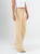 Ref: 069838 Pantalón mom Flare, rígido, tiro alto, tono caqui con desgaste.
