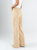 Ref: 069838 Pantalón mom Flare, rígido, tiro alto, tono caqui con desgaste.